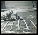Grandpa building a fence