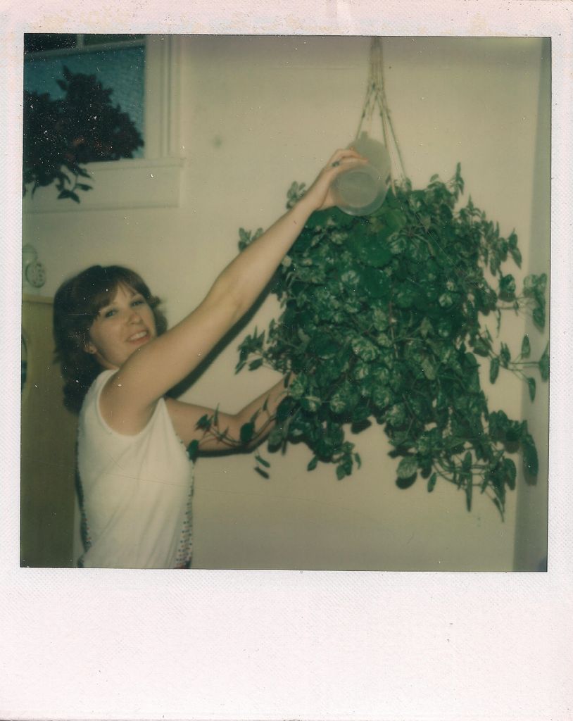 Peggy waters her new plant