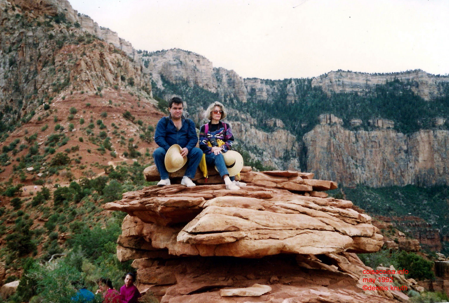 Helton and Sonja setting on a rock formation