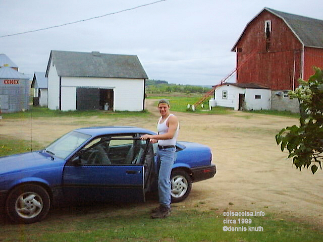 Justin and his car in 1999