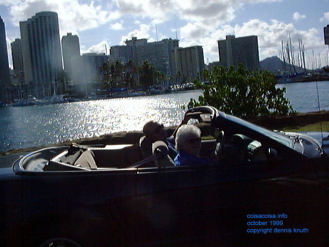 Gloria and Dennis in the convertable on the bay