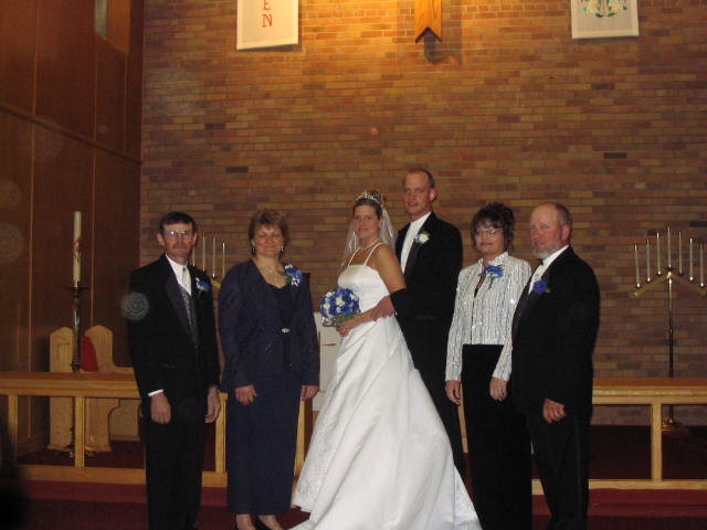 The bride and groom with their Parents in the 2004 wedding