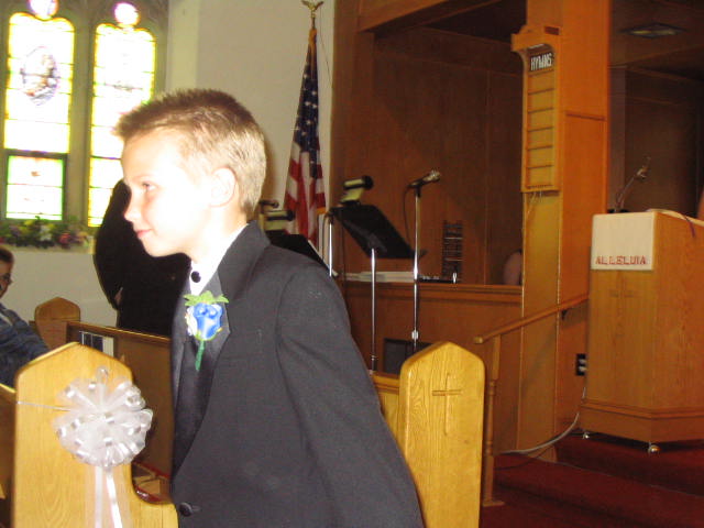 The ring bearer enters the church