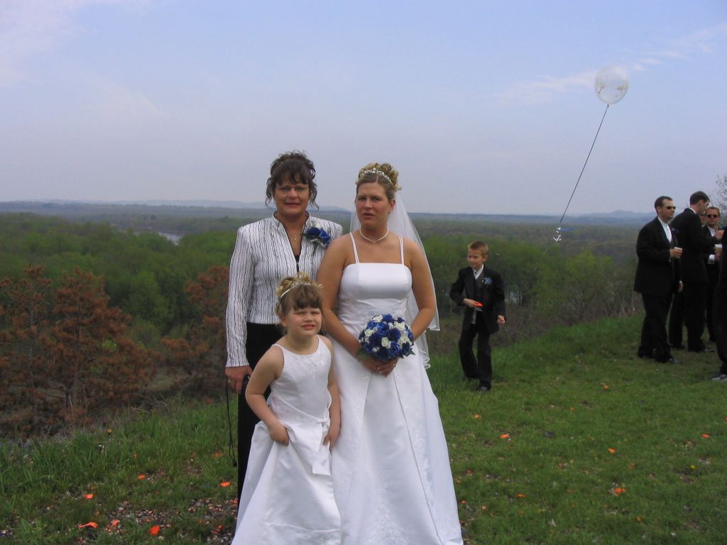 Mother, daughter and bride try to get a good picture