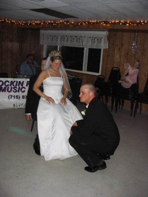 The groom goes after his new wife's garter