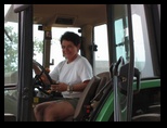 Norma Driving the Tractor on the Durand Farm