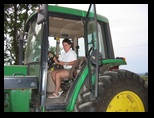 Norma mounting a tractor