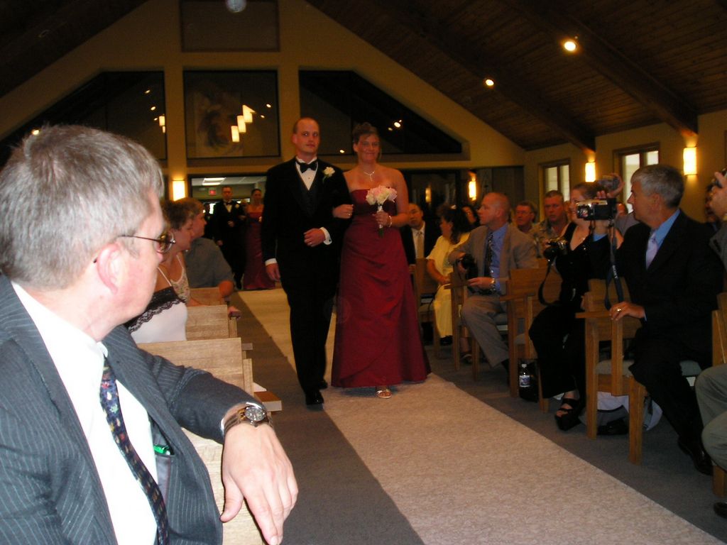 Nathan and bridesmaid coming down the aisle