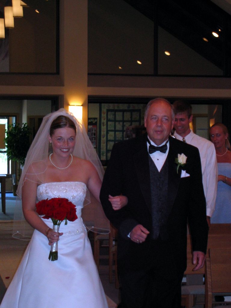 Julia's father walks her down the aisle