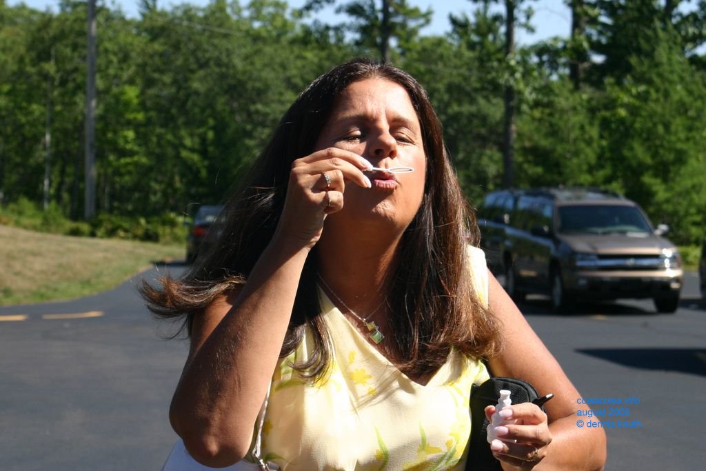 A guest blowing bubbles after the wedding