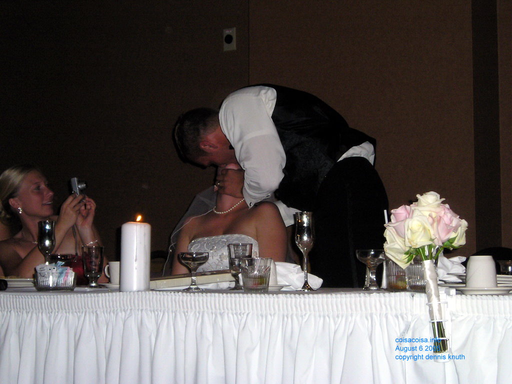 Photographing a wedding kiss by Justin