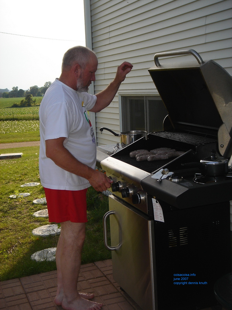 Gary has some bratwurst on the Grill