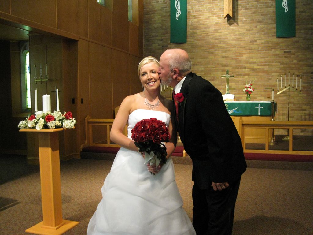 Father kisses the bride