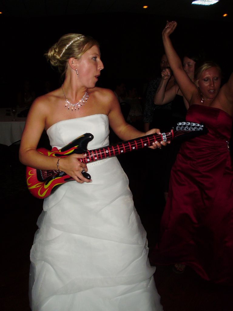 Bride plays guitar