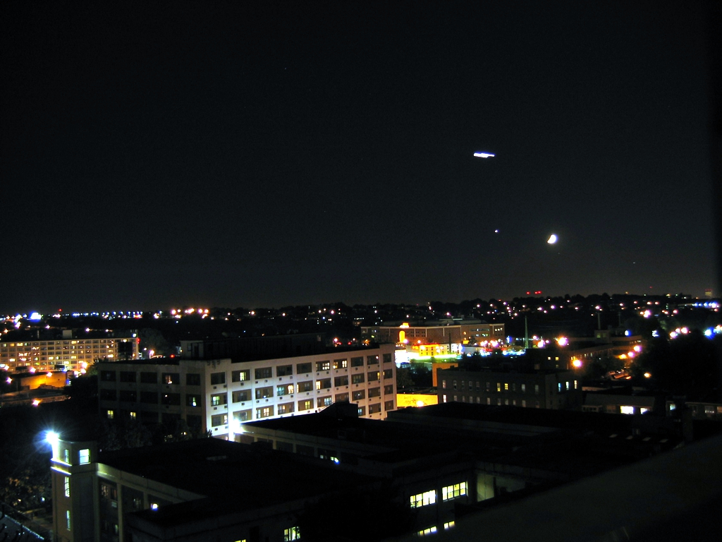 Airplane on approach to La Guardia in the Moonlight