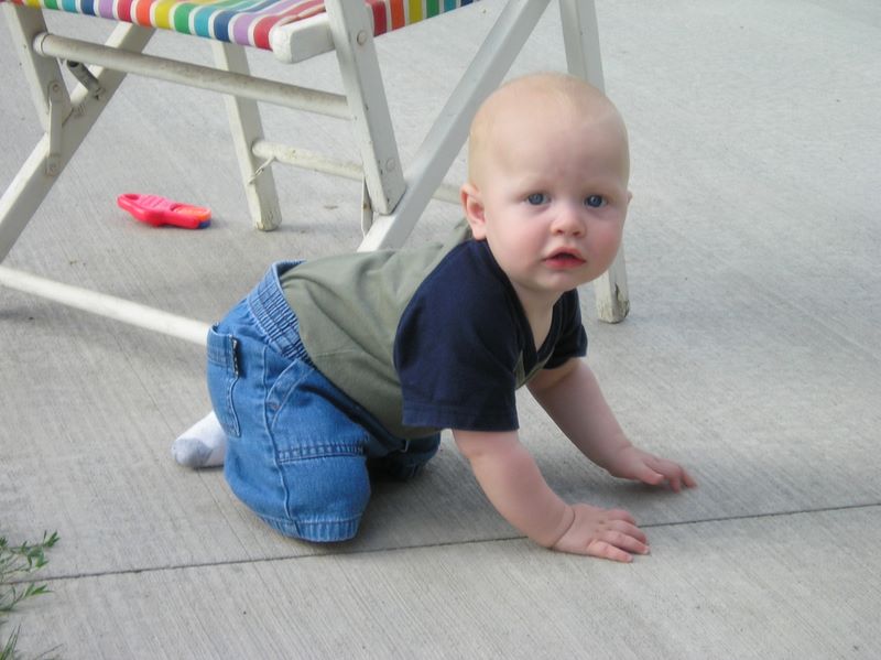 Jared crawls on the concrete