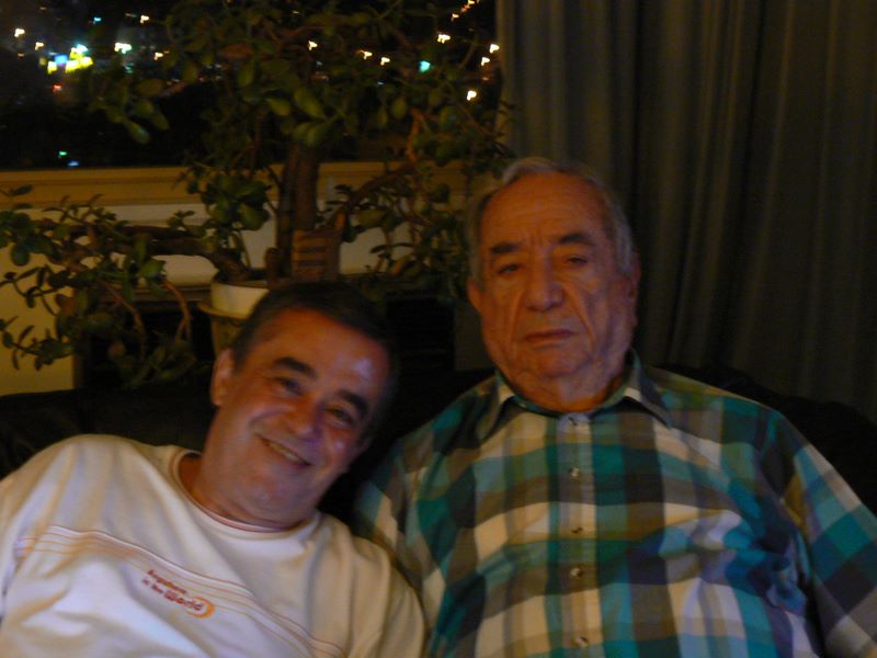 Muscio Jose Lages and Helton on a sofa