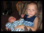 Holding cousin Colin for the first time