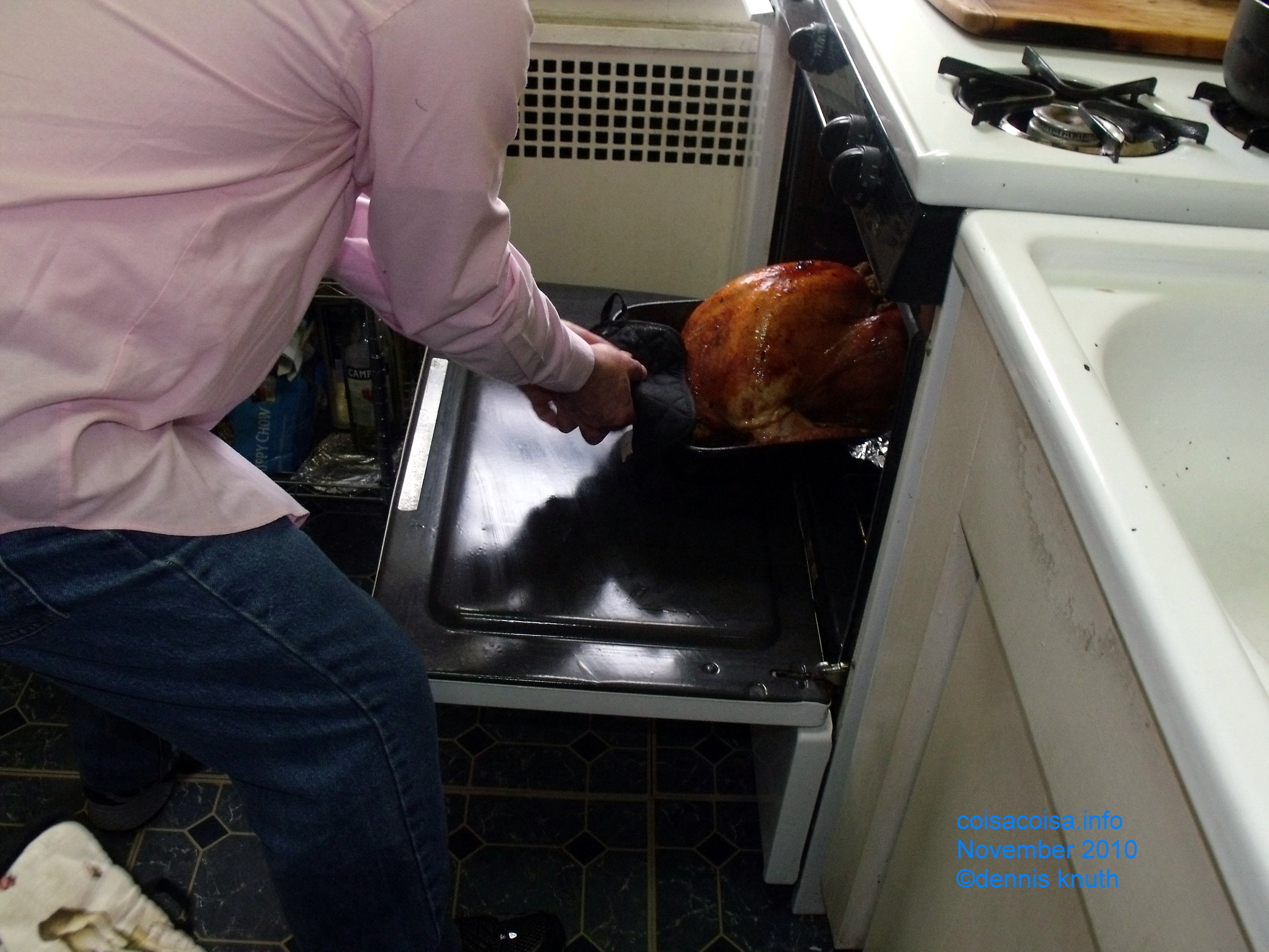 Helton checks the turkey in the Oven