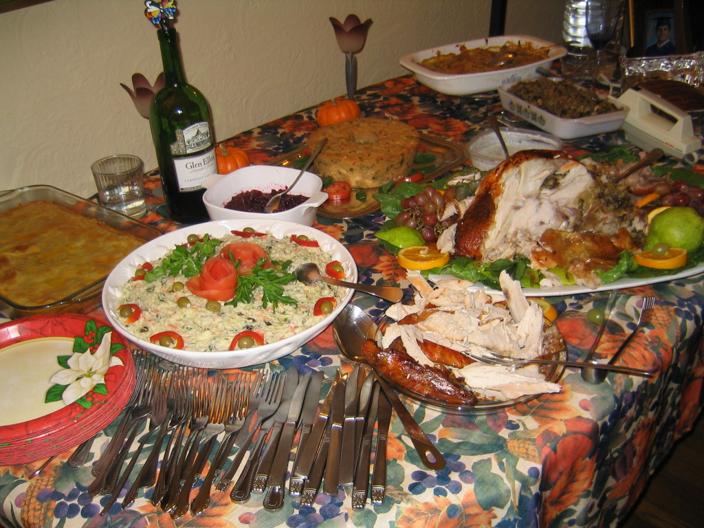 Half devoured turkey and a table setting
