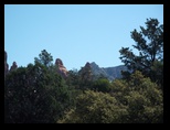 Red Rocks Peaks peek through the trees