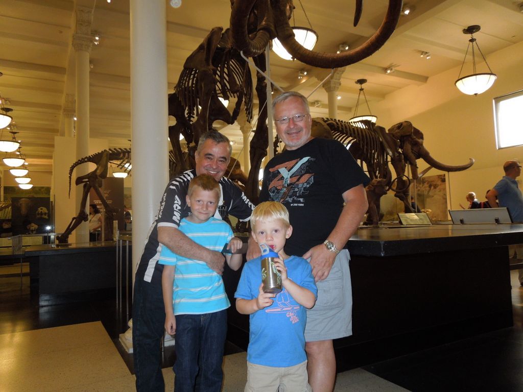 Boys with the dinosaurs at the Museum of Natural History