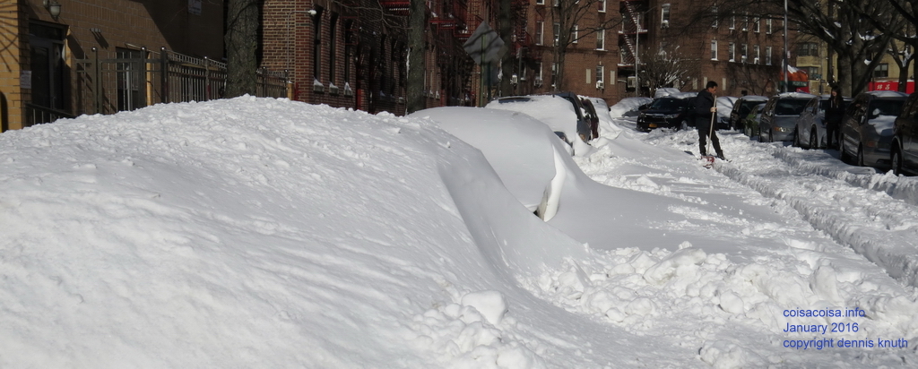 Cars buried under 30 inches of snow