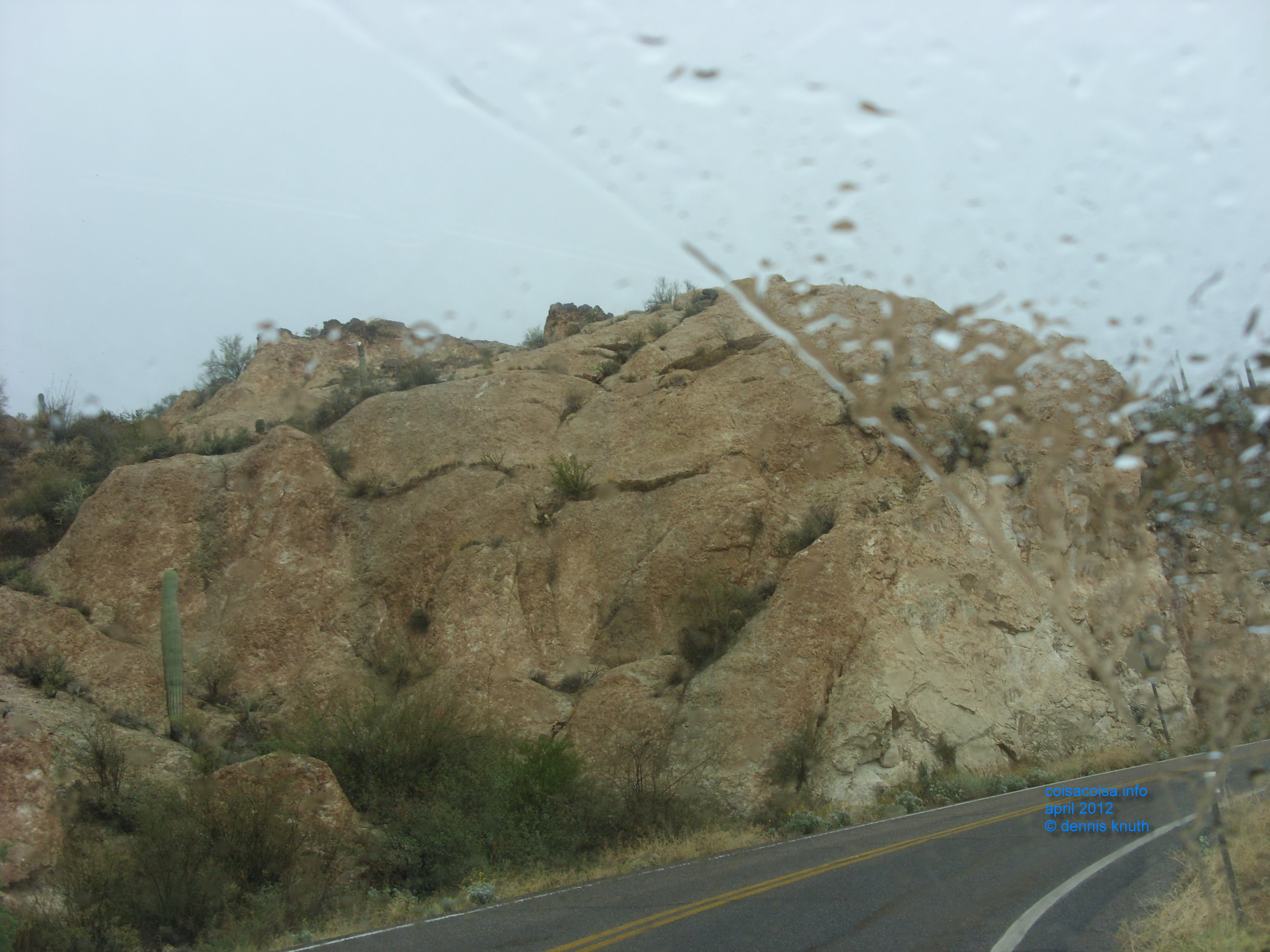Window rain drops and desert boulders