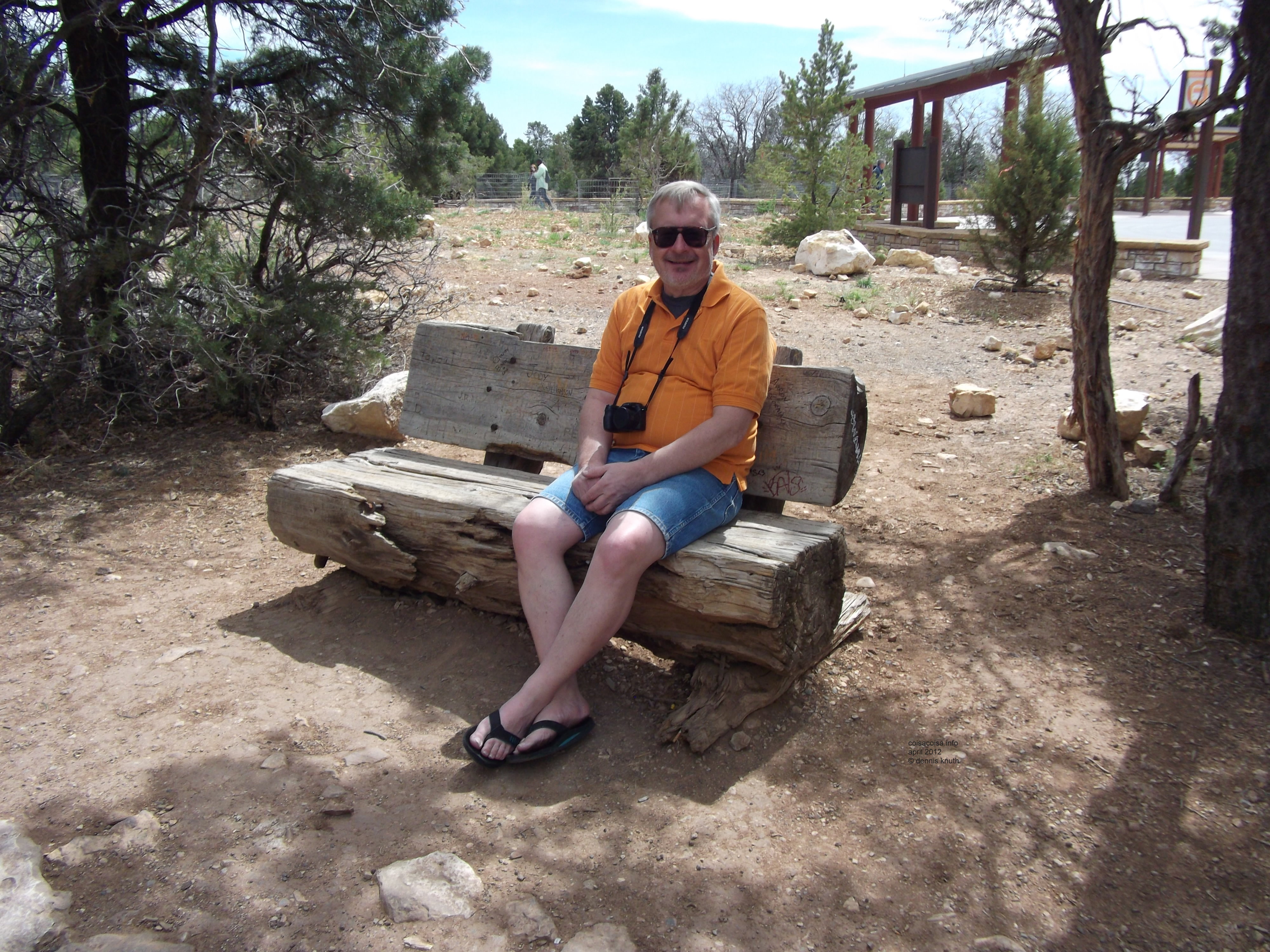 Dennis Knuth setting on a bench at the Grand Canyon