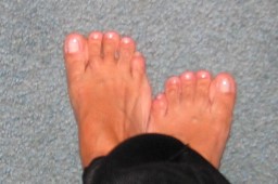 Women's feet on blue