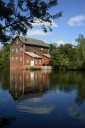 Dells Mill reflecting on the Dells Mill Pond near Augusta Wisconsin