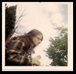 Donadean Sherri setting on the lawn, waiting