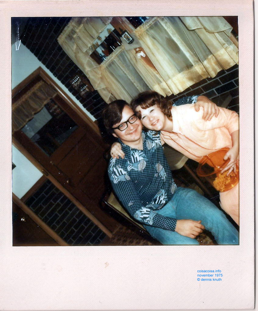 Dennis and Peggy share a hug