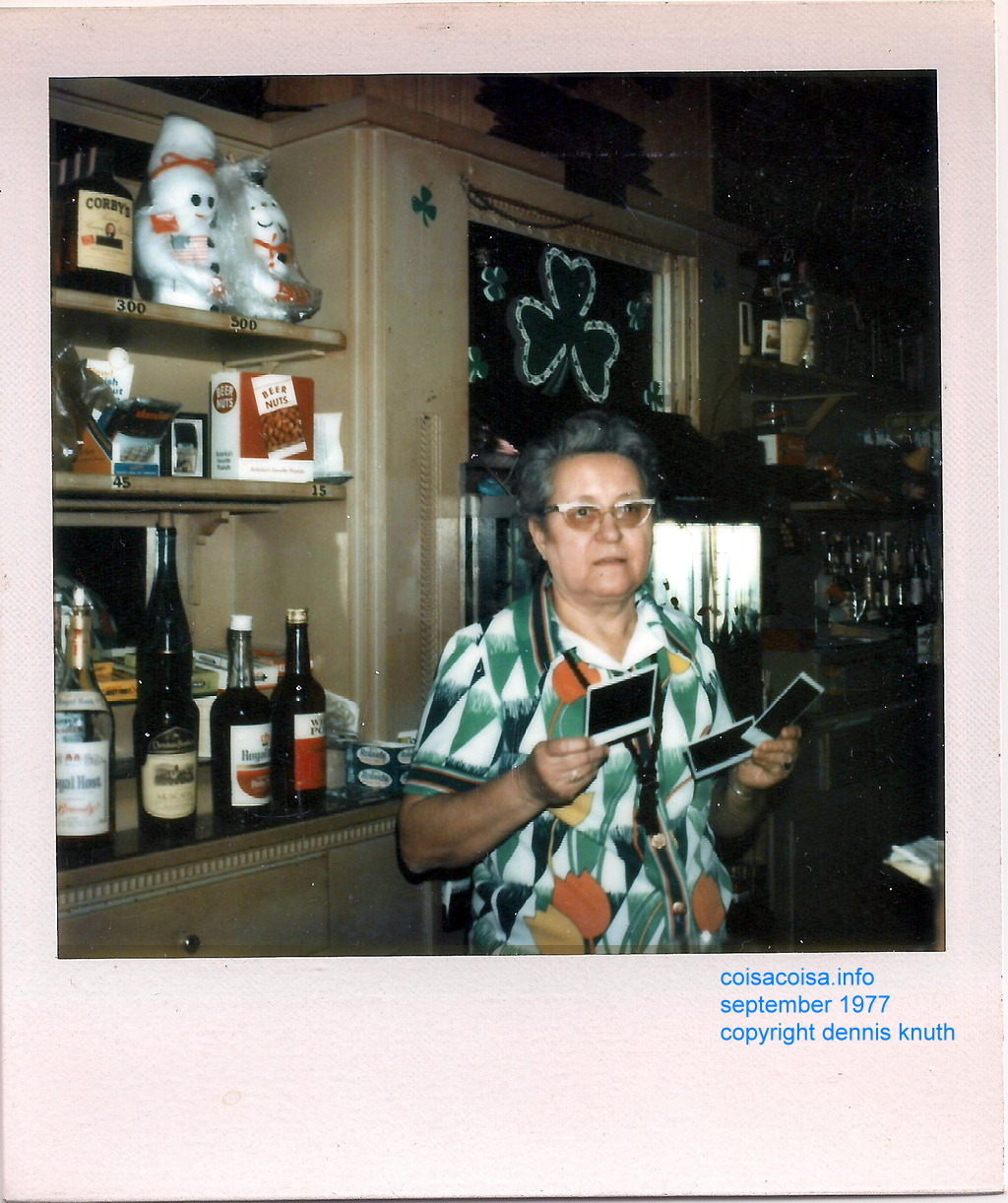 Tess examines the instant Polaroid photos