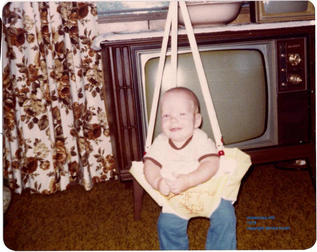 Nathan giggles in his bouncing chair