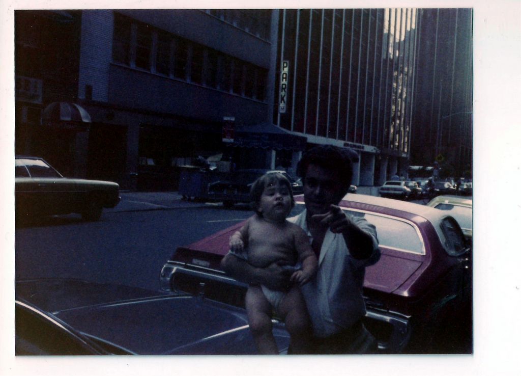 Helton Carrying Filepe on the Streets of Manhattan