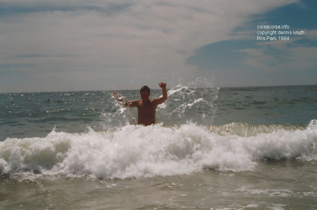 Wave washing over Dennis on the Beach