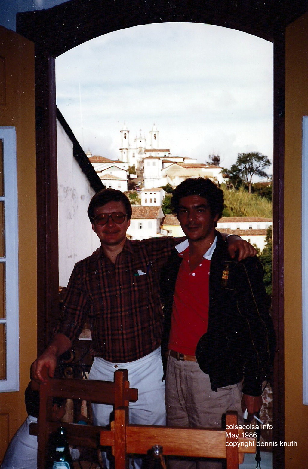 Eduardo and Dennis in a restaurant window arch