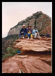 Regina, Helton and Sonja resting on a rock foramation