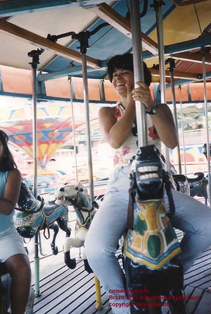 Helenice rides the merry-go-round