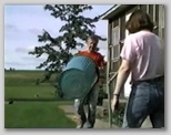 Sherri and Emogene Work on the Lawn