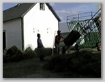 Putting the hay bales in the hay mow