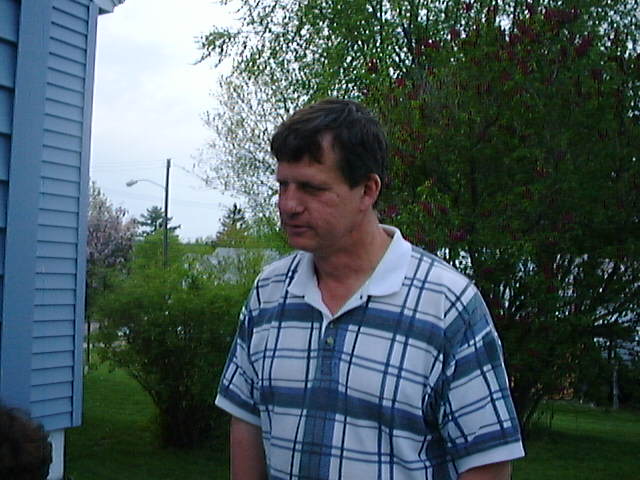 Tom listing to sister Nancy on the patio at her house