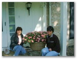 Rose and Helenice with flowers entering Jeanettes House