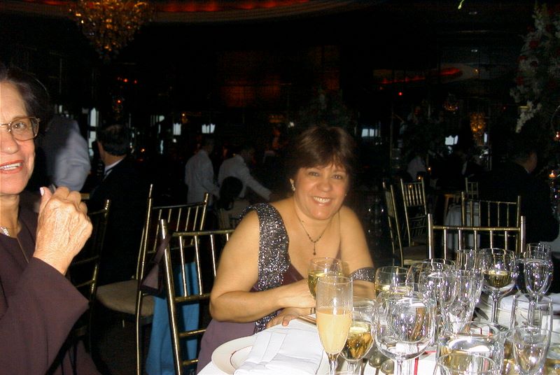 Heloisa at a reception table