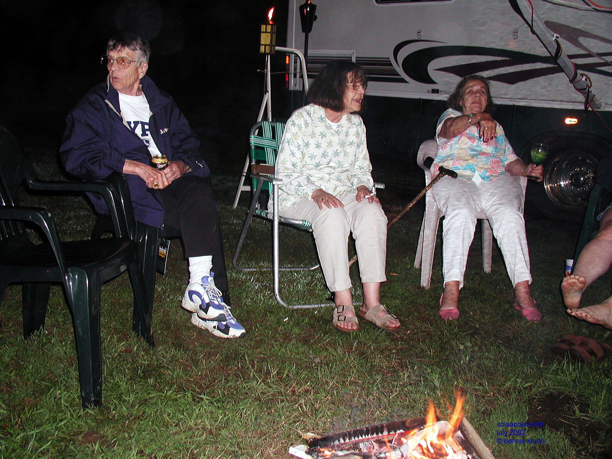 Sisters around a campfire