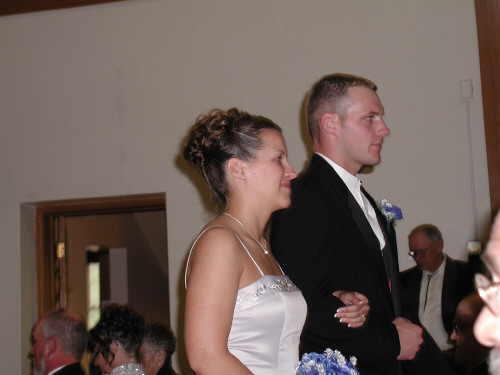 Justin and bridesmaid enter