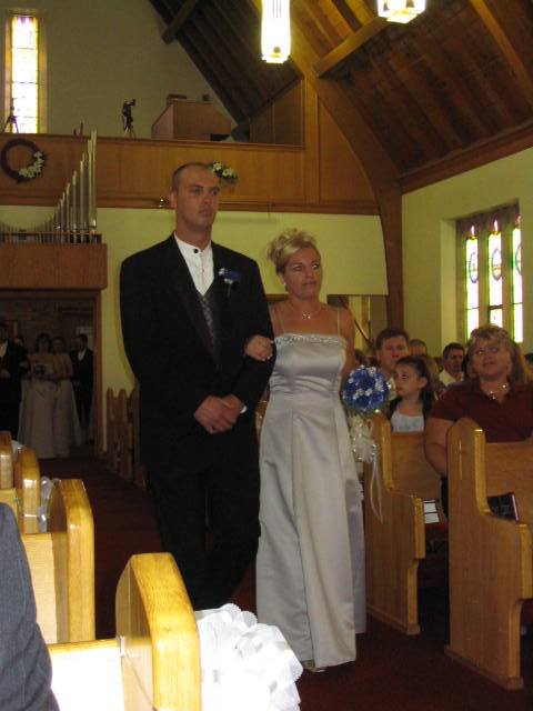 Brides maid and grooms man unidentified