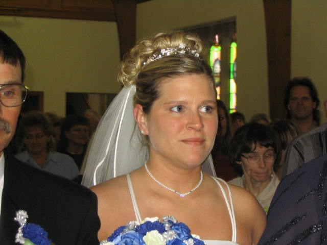 The bride's father walkes her down the aisle