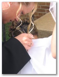 The bride getting her dress fixed